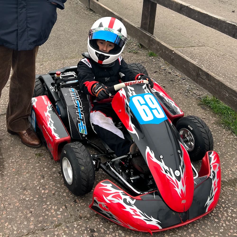 Young kart racer in action